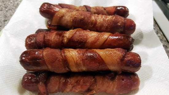 Deep Fried Bacon Wrapped Hot Dogs
 YES Bacon wrapped around a hot dog deep fried and