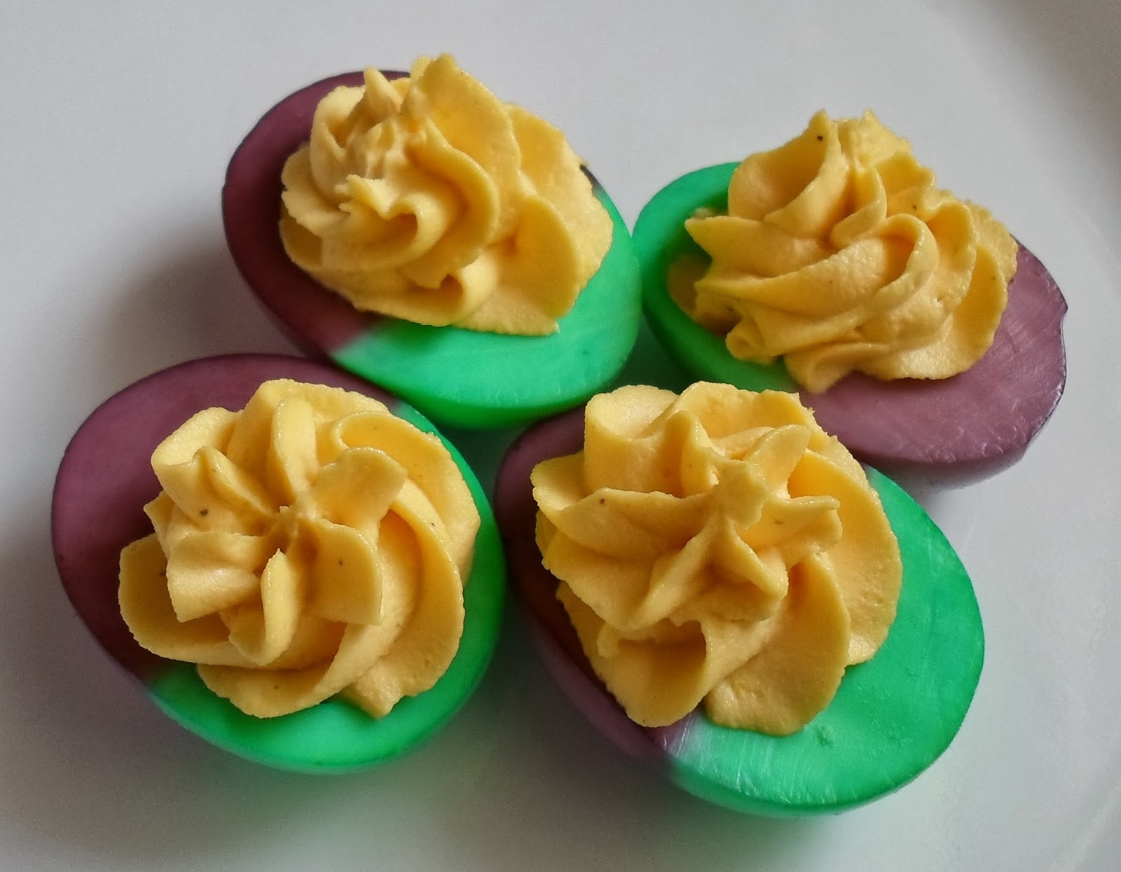 Dyed Deviled Eggs
 Happier Than A Pig In Mud Mardi Gras Dyed Deviled Eggs