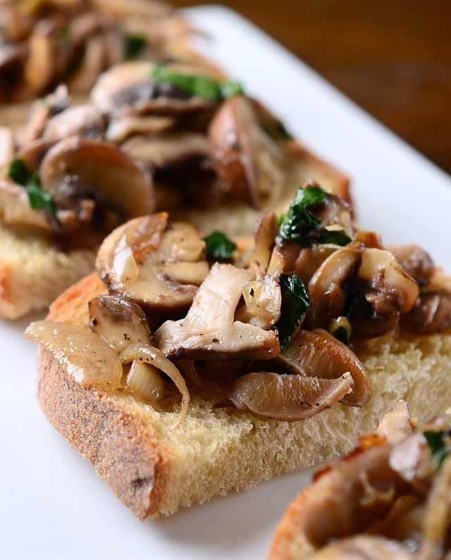 Sauteed Mushroom Appetizers
 Sauteed mushrooms atop a garlicky crusty bread A simple