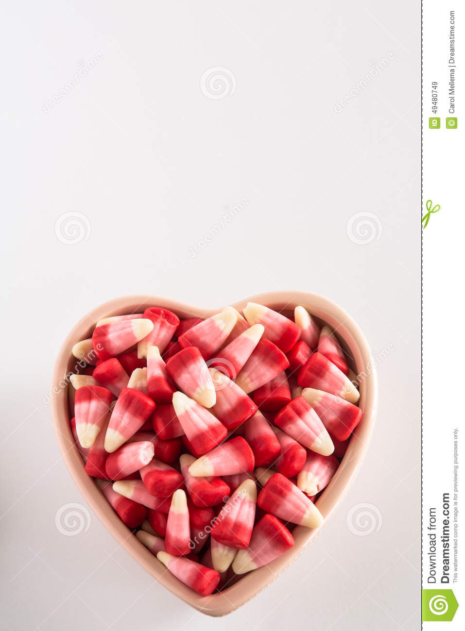 Valentines Day Candy Corn
 Valentines Day Candy Corn In Heart Shaped Bowl Stock Image